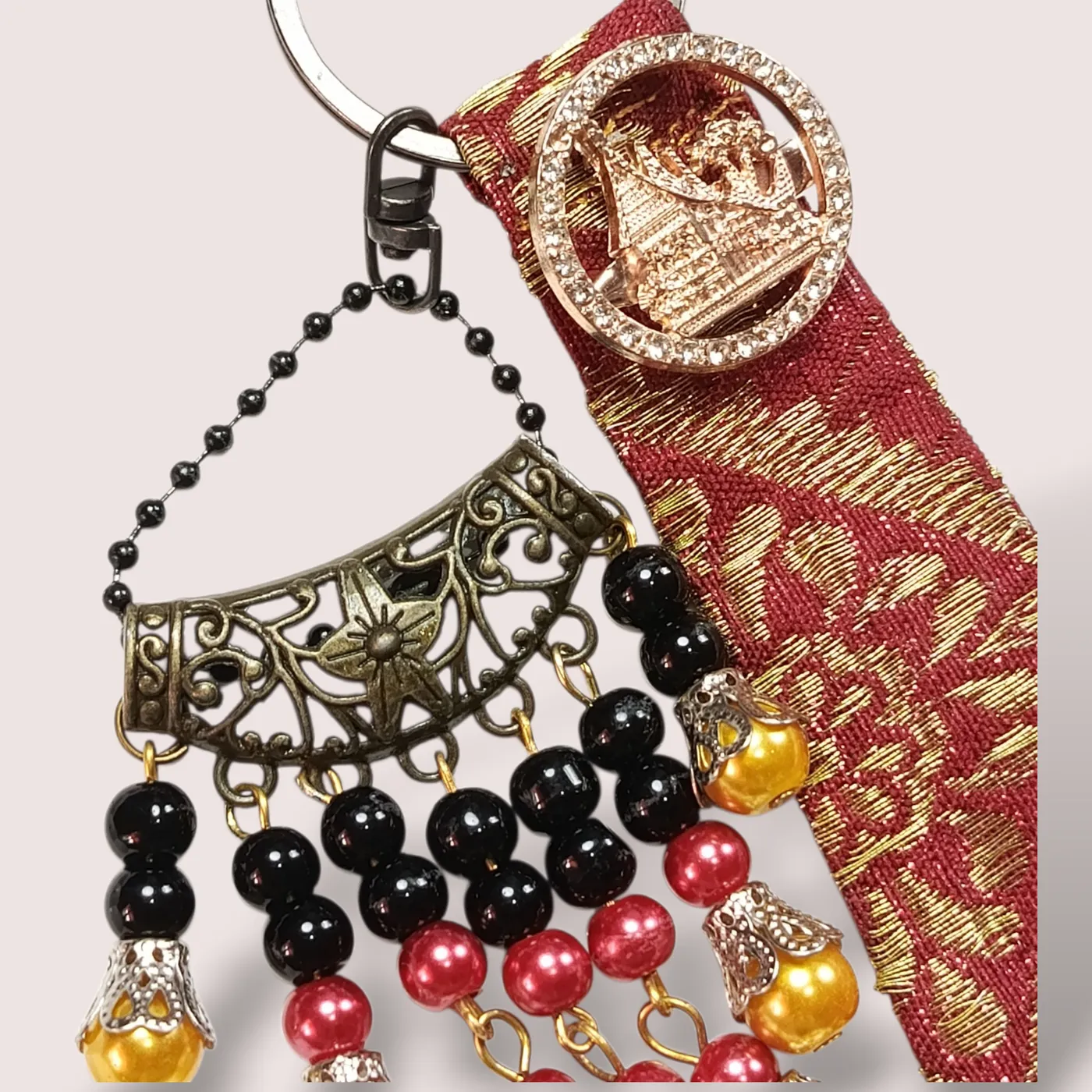 Gantungan Tas / Kunci Etnik Minangkabau Elegan dengan Sentuhan Songket Asli dan Mutiara Marawa Sintetis — tampilan 2